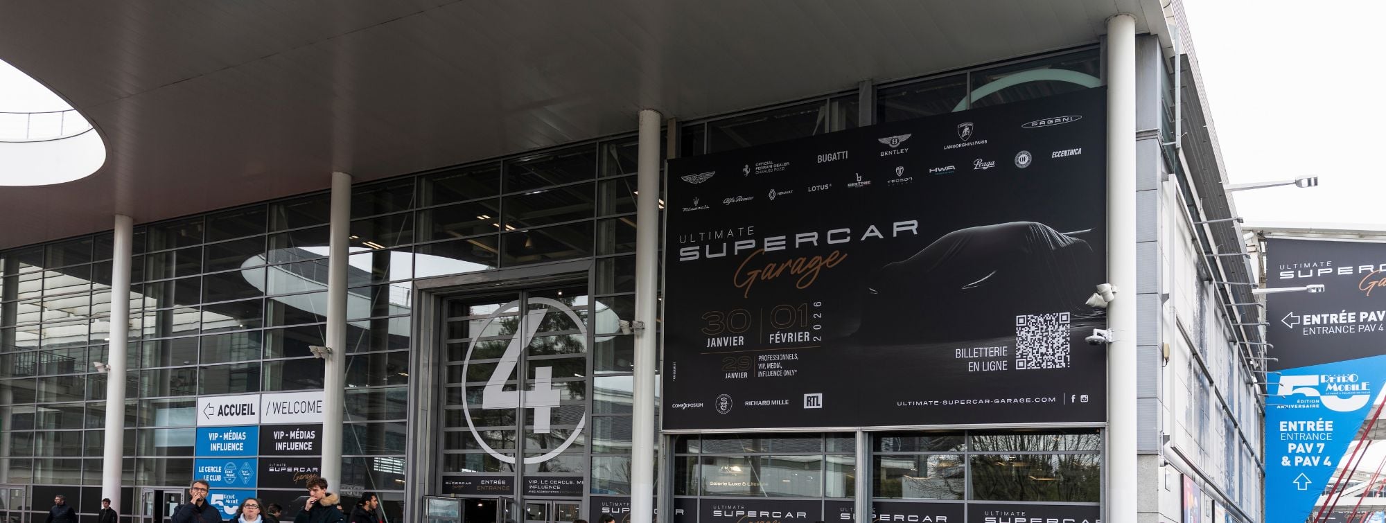 Entrance of Ultimate Supercar Garage with event signage and outdoor display at Paris Expo Porte de Versailles