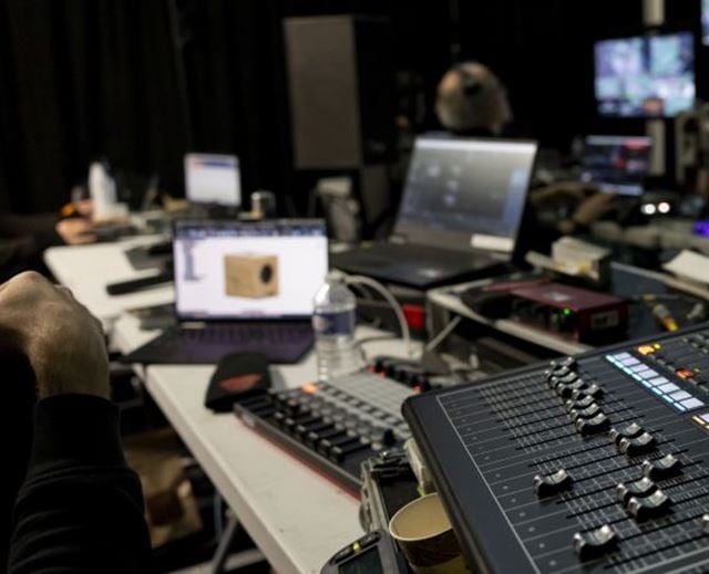 Audio mixing console and technical equipment used to manage an automotive event.