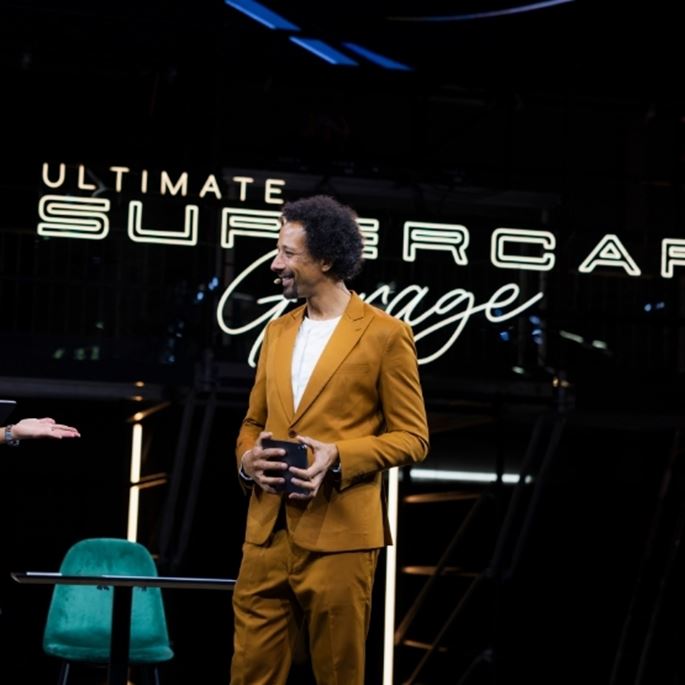 journalist speaking on stage