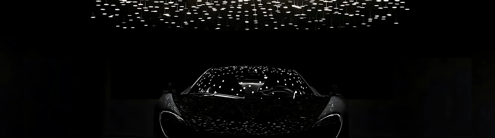 black car on a black background with a chandelier