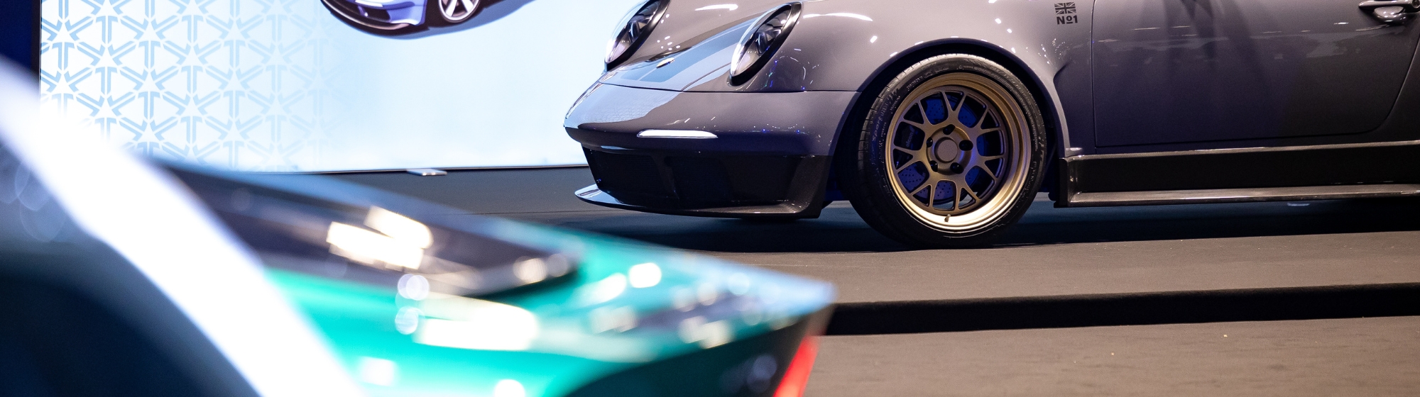 black car on a black background with a chandelier